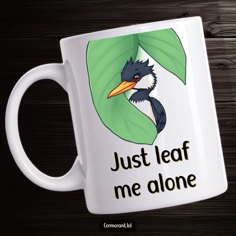 Funny Cormorant Mug: A curious cormorant playfully peeking from behind a large, wet leaf, showcasing its mischievous personality.