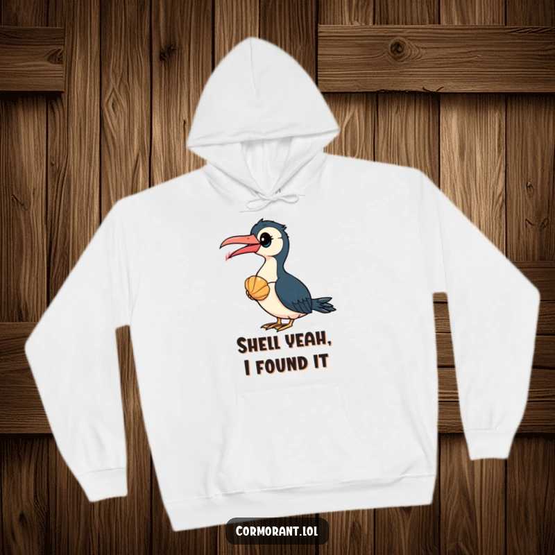 Funny Cormorant Hoodie: A curious cormorant bird examines a bright seashell, a humorous depiction of nature's little mysteries.