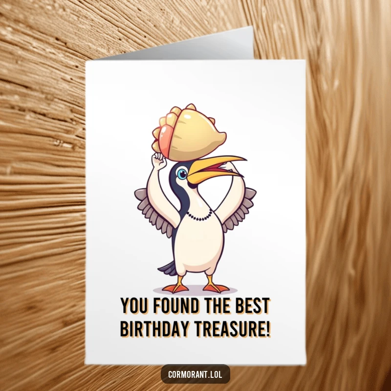 Funny Free Printable Cormorant Birthday Card: A triumphant cormorant proudly holds a colorful shell, celebrating a special day.