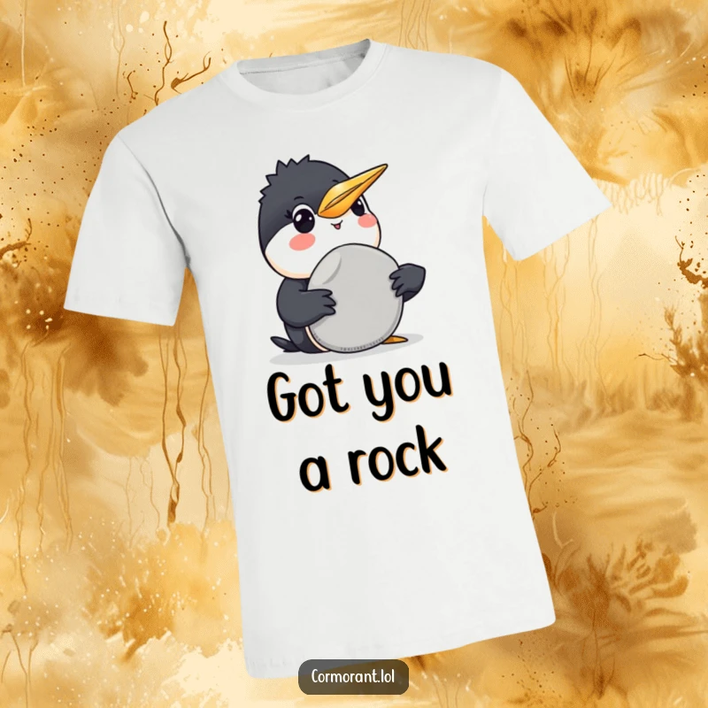 Funny Cormorant T-Shirt: A happy cormorant presents a smooth grey pebble with a warm smile, embodying funny generosity.