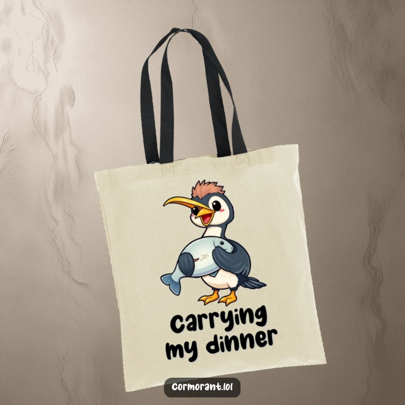 Funny kawaii cormorant tote bag depicting a joyful bird holding a large, shiny fish, great for carrying essentials.