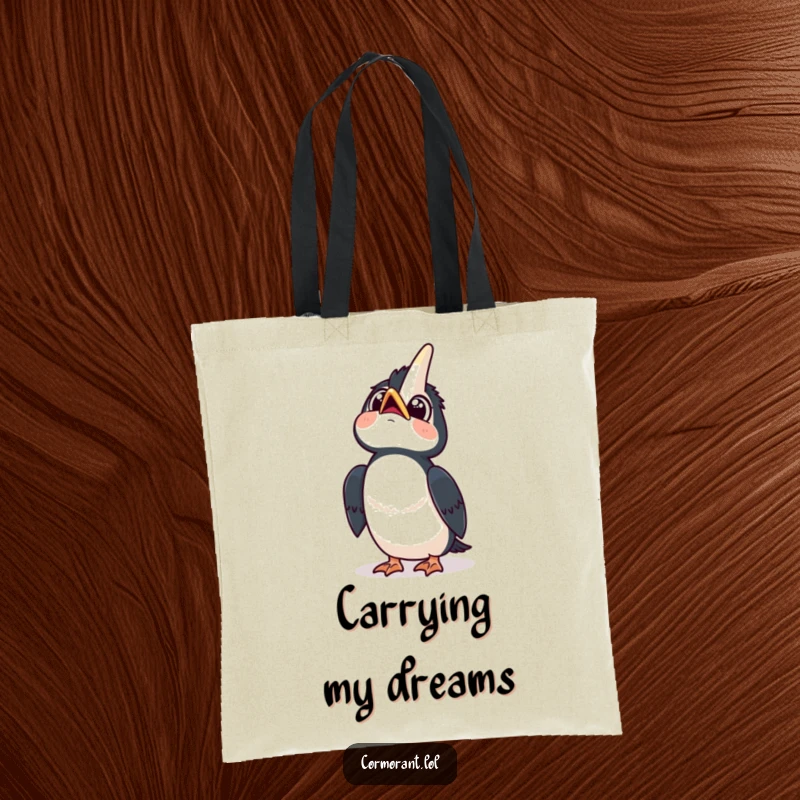 Funny tote bag showcasing a kawaii cormorant looking up at the sky with wide, curious eyes and a happy tilt, a portable inspiration.